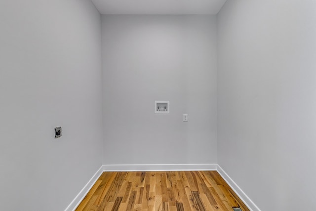 282 Regina Rd, Lancaster, VA 22503 - laundry room featuring electric dryer hookup, washer hookup, baseboards, and light wood-style flooring