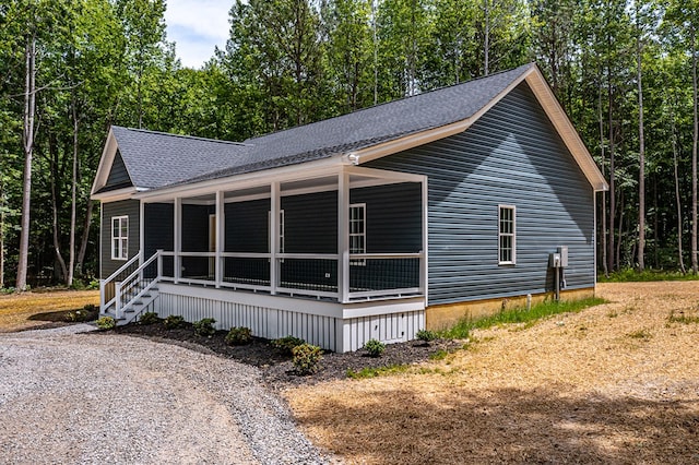 282 Regina Rd, Lancaster, VA 22503 - view of side of property featuring covered porch and roof with shingles