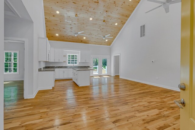 282 Regina Rd, Lancaster, VA 22503 - kitchen with a ceiling fan, high vaulted ceiling, white cabinets, light wood-type flooring, and plenty of natural light