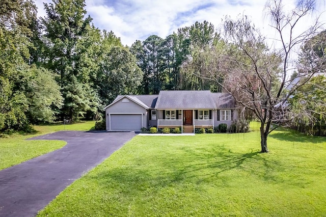 ranch-style home featuring a porch, a garage, and a front lawn