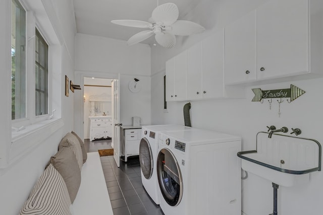 laundry area featuring dark tile patterned flooring, washer and clothes dryer, cabinet space, and a ceiling fan