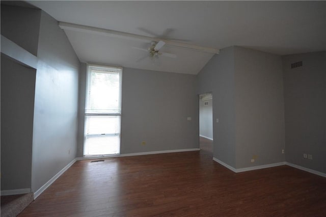 empty room featuring vaulted ceiling, ceiling fan, and dark hardwood / wood-style flooring