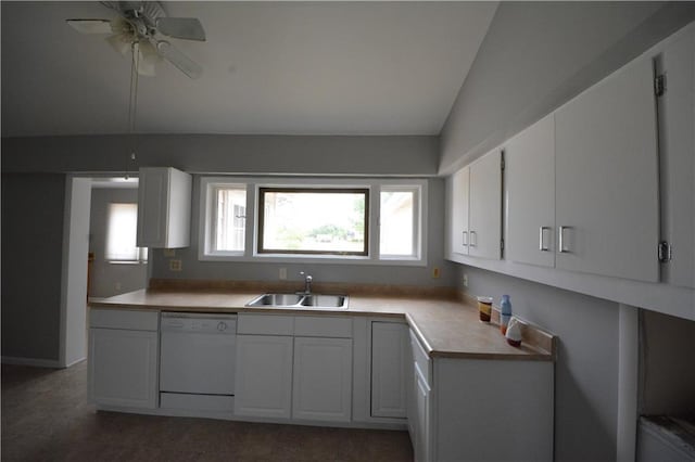 kitchen featuring ceiling fan, vaulted ceiling, sink, white dishwasher, and white cabinetry