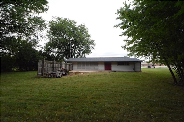 back of house with a yard