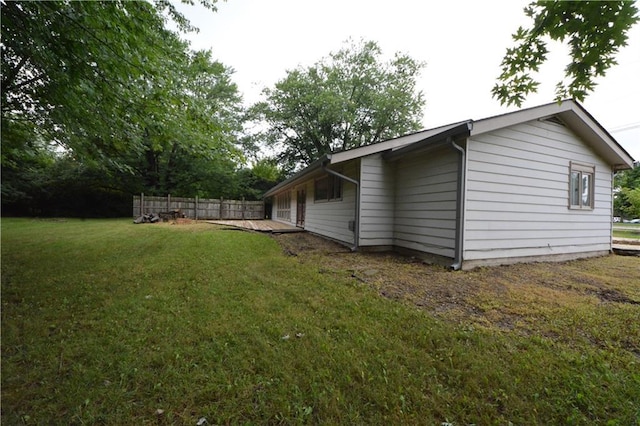 view of side of property featuring a lawn