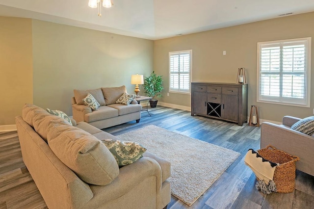 living room featuring dark wood-type flooring