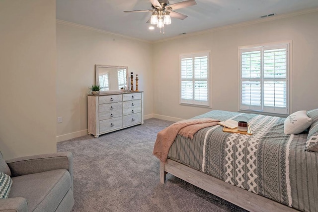 carpeted bedroom featuring ceiling fan and crown molding