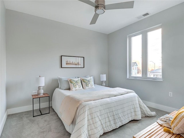 bedroom featuring ceiling fan and light colored carpet