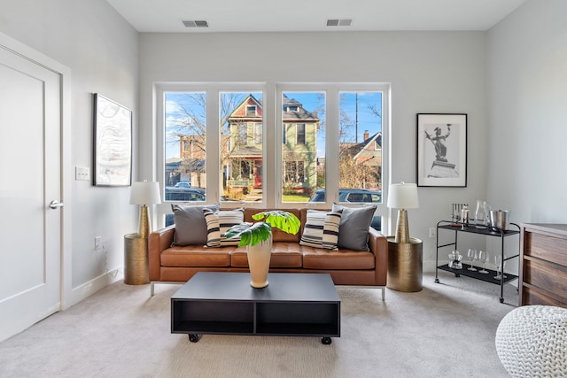 living area with light colored carpet