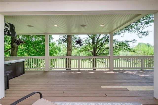 wooden deck with a jacuzzi