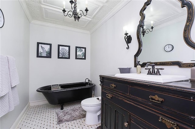 bathroom with crown molding, toilet, vanity, and a washtub