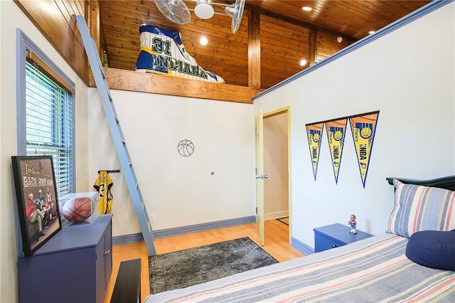 bedroom with wooden ceiling and light hardwood / wood-style flooring