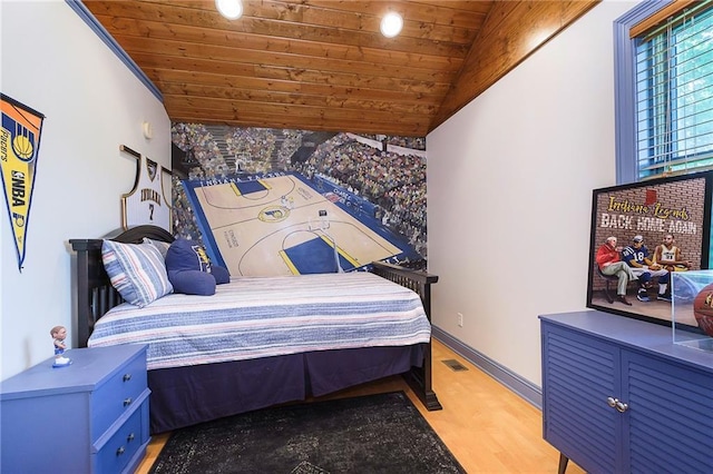 bedroom with light wood-type flooring, vaulted ceiling, and wooden ceiling