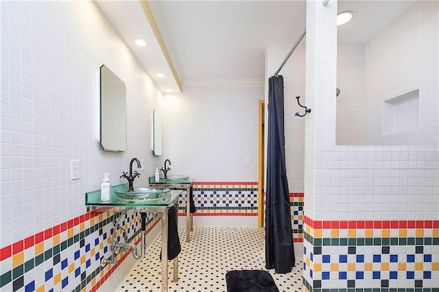 bathroom with ornamental molding, tile walls, vanity, and curtained shower