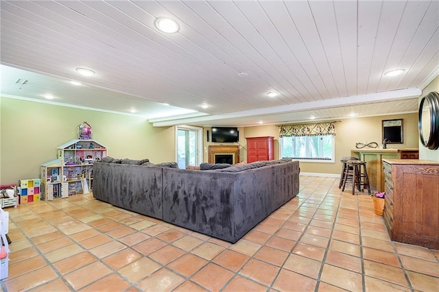 tiled living room featuring ornamental molding and bar