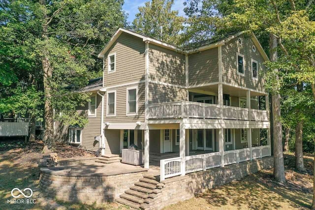 exterior space with a balcony and covered porch