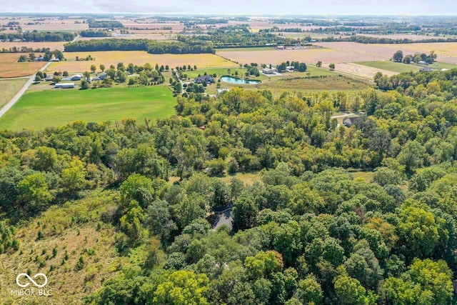 birds eye view of property with a rural view