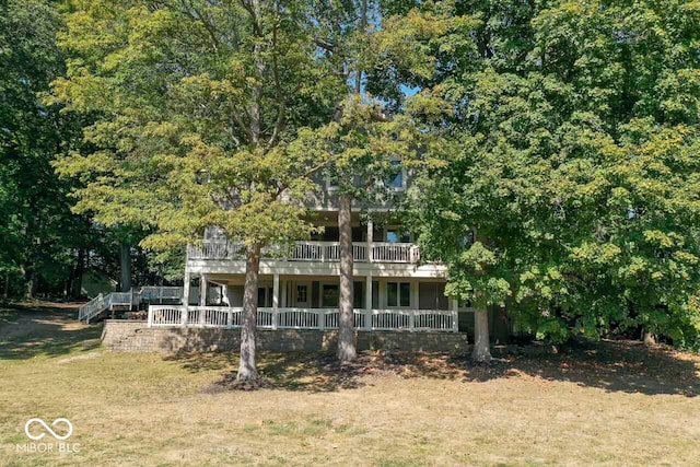 view of front facade with a wooden deck