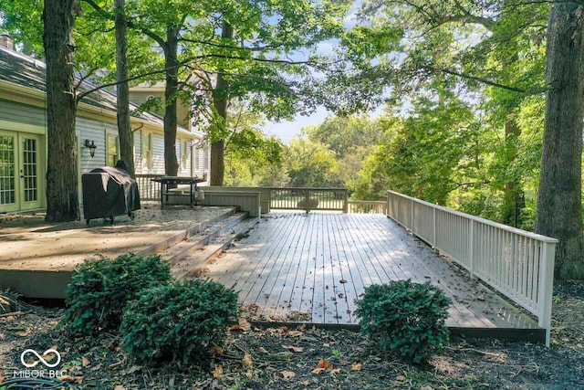 wooden deck with grilling area