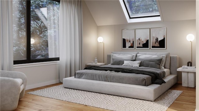 bedroom with lofted ceiling with skylight and light hardwood / wood-style floors