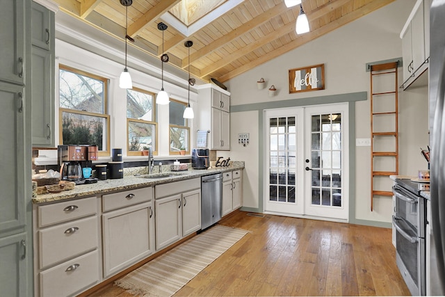 kitchen featuring wooden ceiling, hanging light fixtures, beamed ceiling, and a skylight