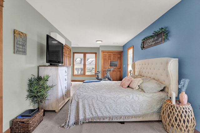 bedroom featuring light colored carpet