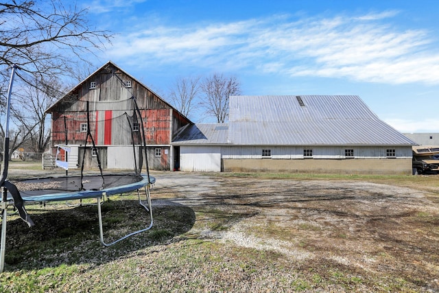 back of property with a trampoline