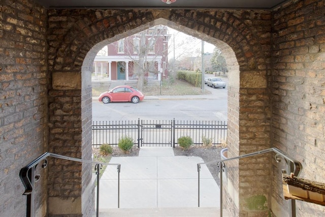 exterior space featuring brick wall