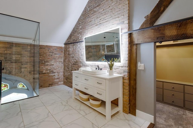 bathroom featuring brick wall, high vaulted ceiling, large vanity, and tile flooring