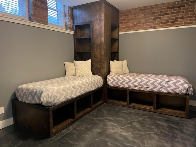 bedroom with brick wall