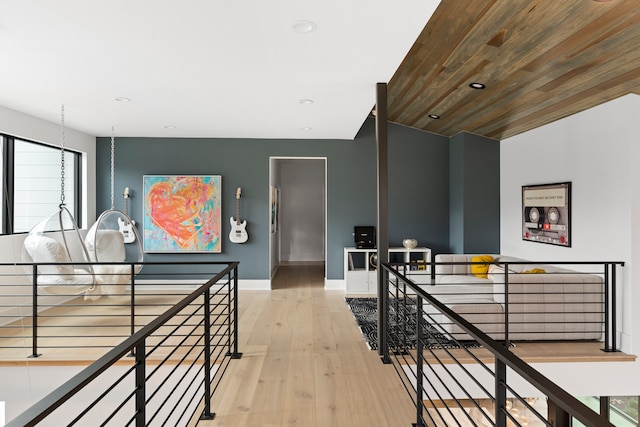 hall featuring light hardwood / wood-style floors and wood ceiling