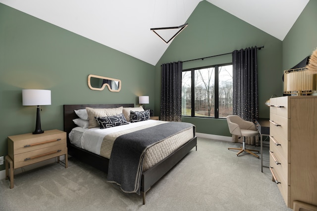 carpeted bedroom featuring vaulted ceiling