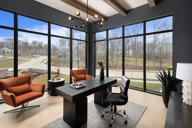 office area with plenty of natural light, beam ceiling, a chandelier, and light hardwood / wood-style flooring