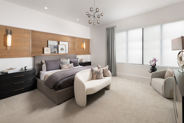 bedroom with a notable chandelier and light carpet