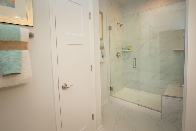 bathroom with a shower with shower door