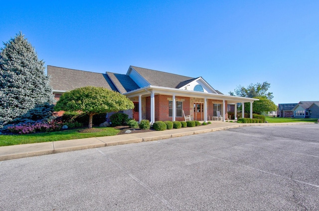 view of front of property featuring covered porch