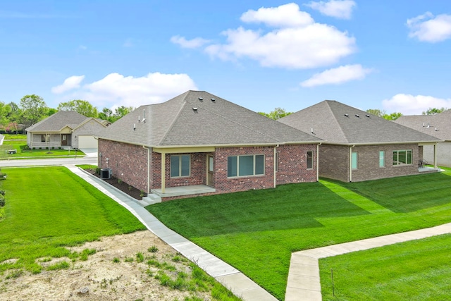 exterior space featuring a garage and a front lawn