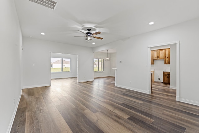 unfurnished room featuring dark hardwood / wood-style floors and ceiling fan