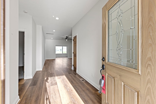 foyer with dark hardwood / wood-style flooring and ceiling fan