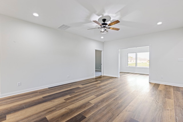 unfurnished room featuring ceiling fan and dark hardwood / wood-style flooring