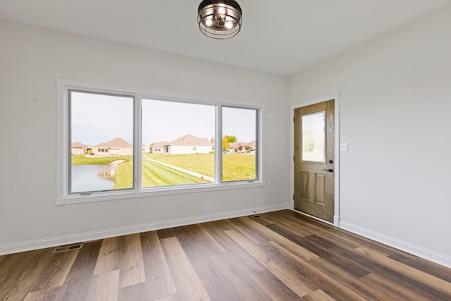 empty room with dark wood-type flooring