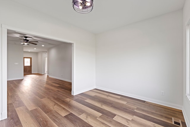 spare room featuring hardwood / wood-style flooring and ceiling fan