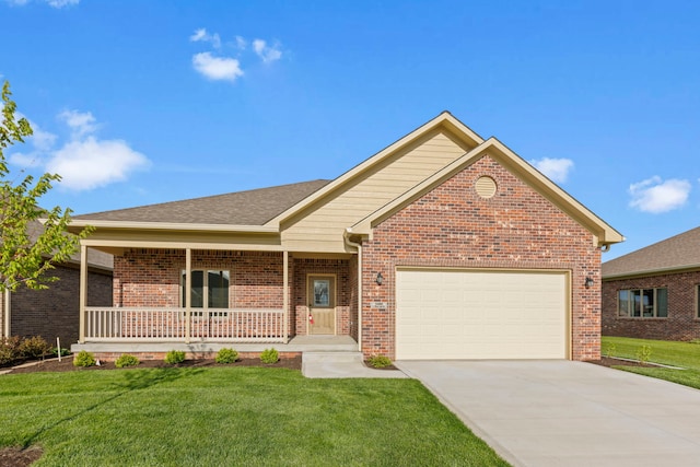 view of front of home featuring a garage, a front lawn, and a porch