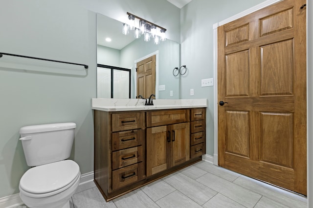 bathroom with tile flooring, vanity, and toilet