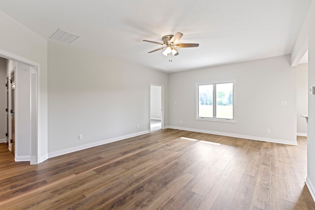 empty room featuring ceiling fan and hardwood / wood-style flooring