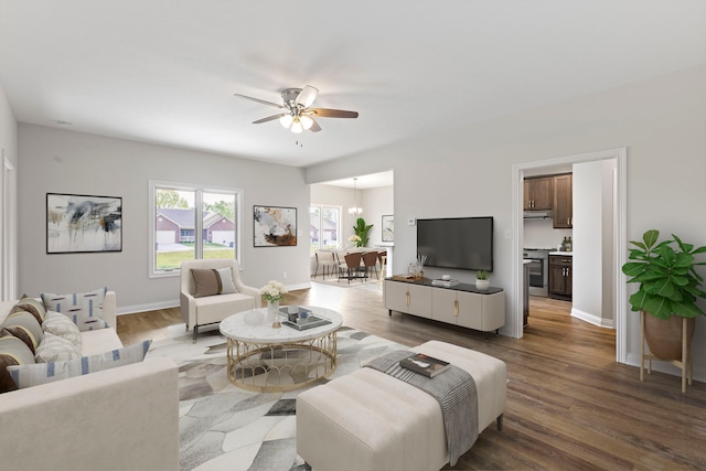 living room with hardwood / wood-style floors and ceiling fan