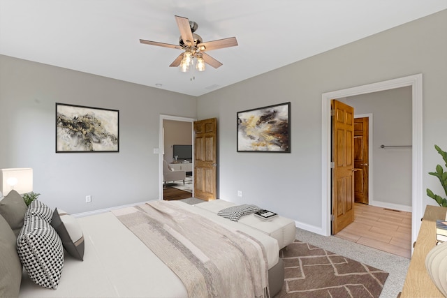 tiled bedroom with ceiling fan