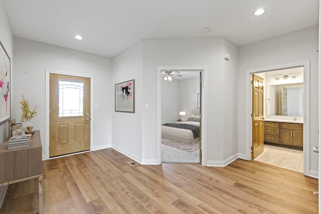 entryway featuring ceiling fan and light wood-type flooring