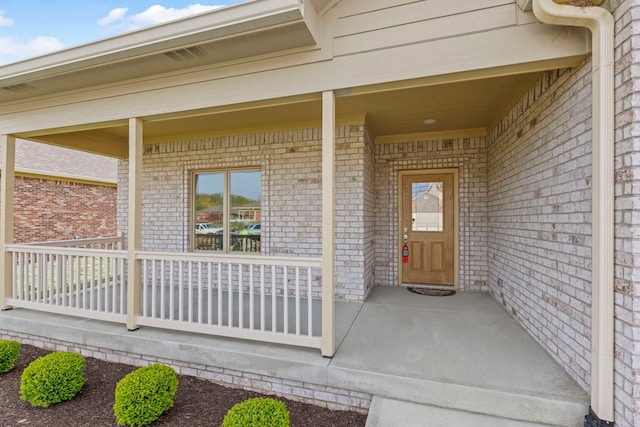 property entrance featuring a porch