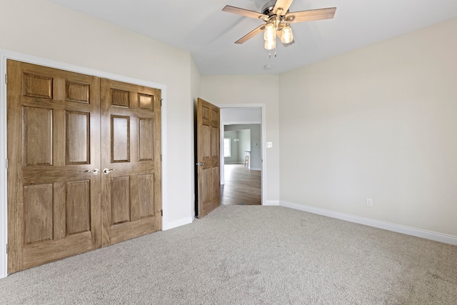 unfurnished bedroom with carpet flooring, a closet, and ceiling fan